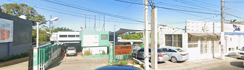 Fachada del taller J&S Auto Repair vista desde la calle